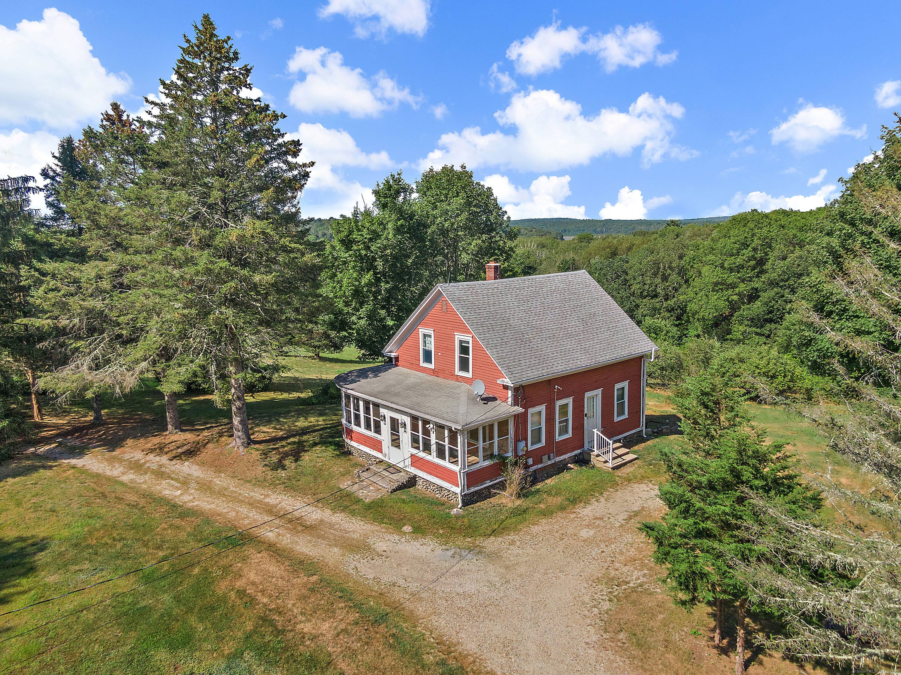 Nestled in an idyllic country setting, this 1900 farmhouse offers a unique opportunity to embrace rural living.