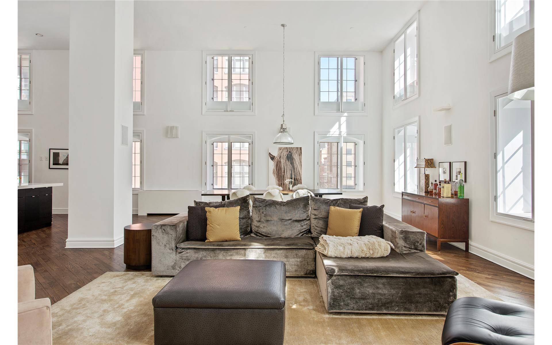 Dramatic corner loft with double height ceilings spanning over 3, 400 square feet in a full service building located in the PRIME Tribeca neighborhood where many influential names in the ...