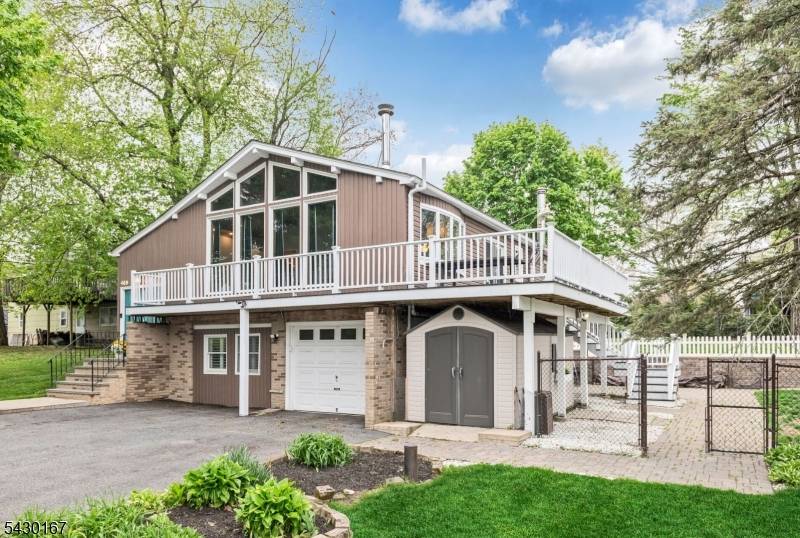 Spectacular water views and sun filled living spaces define this updated 3 Bedroom, 3 Bath contemporary home set on approximately.