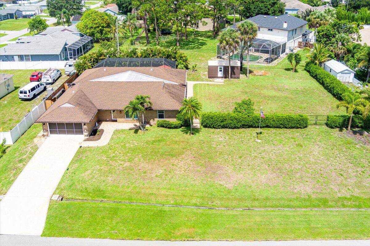 Beautiful pool home on a spacious half acre lot !