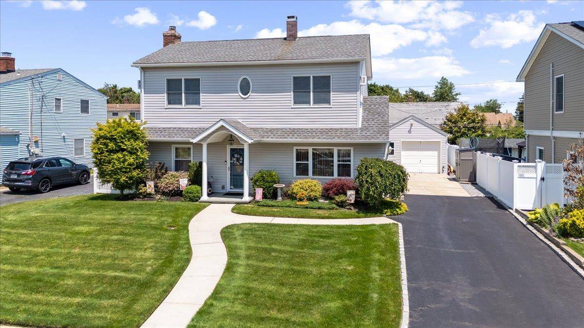One of a kind Custom Extended and Expanded Colonial in the Heart of Levittown must be Seen to be Truly Appreciated.