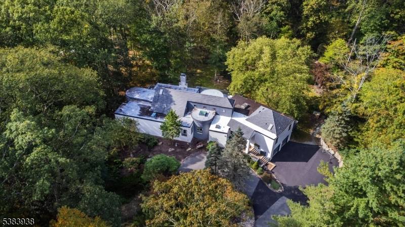 Prepare to be captivated by this stunning, beautifully updated contemporary estate nestled on a serene, private 3.