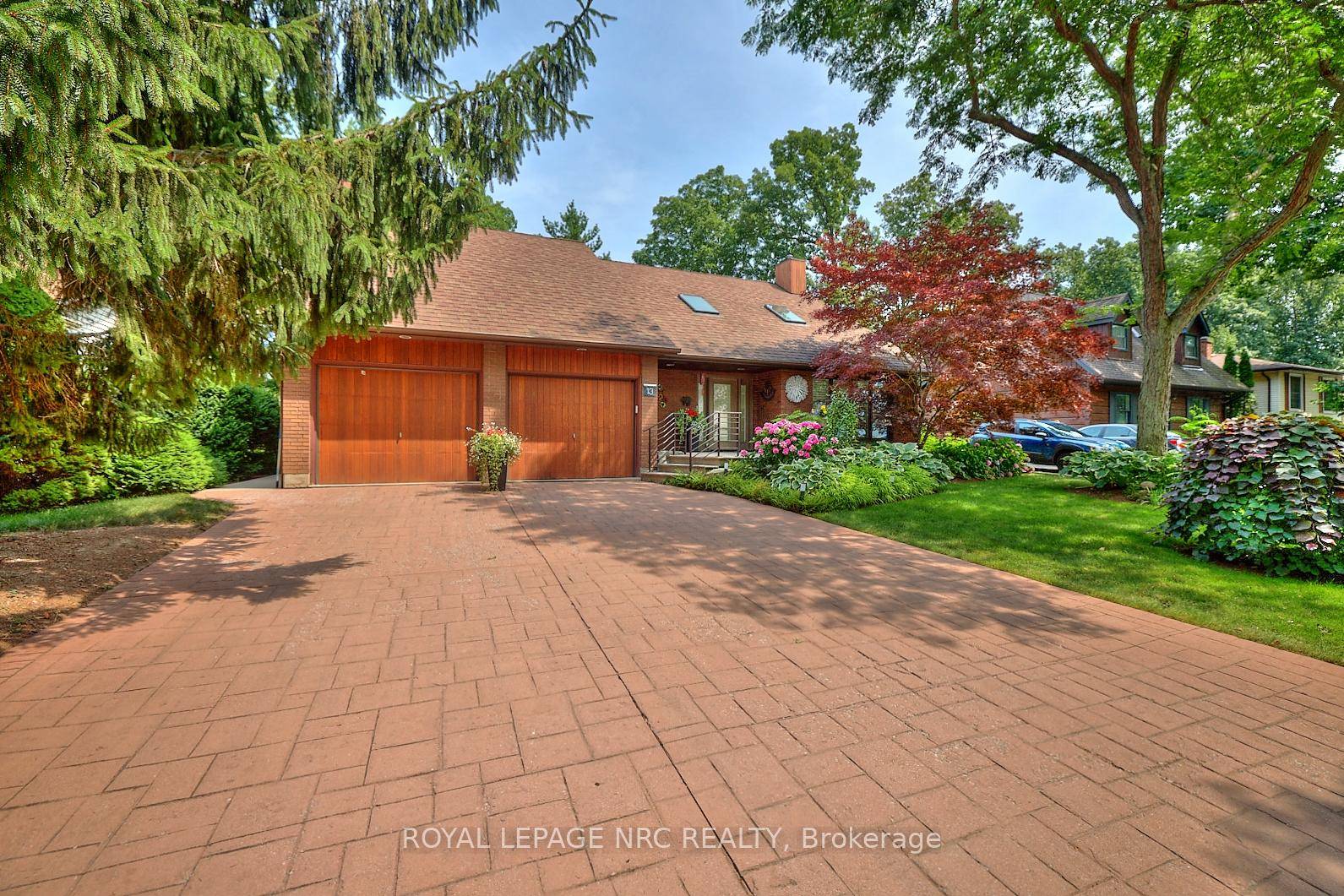 In the heart of Niagara on the Lake, in a park like setting, sits this one of a kind, custom built, 2 story, 3 bed 2.