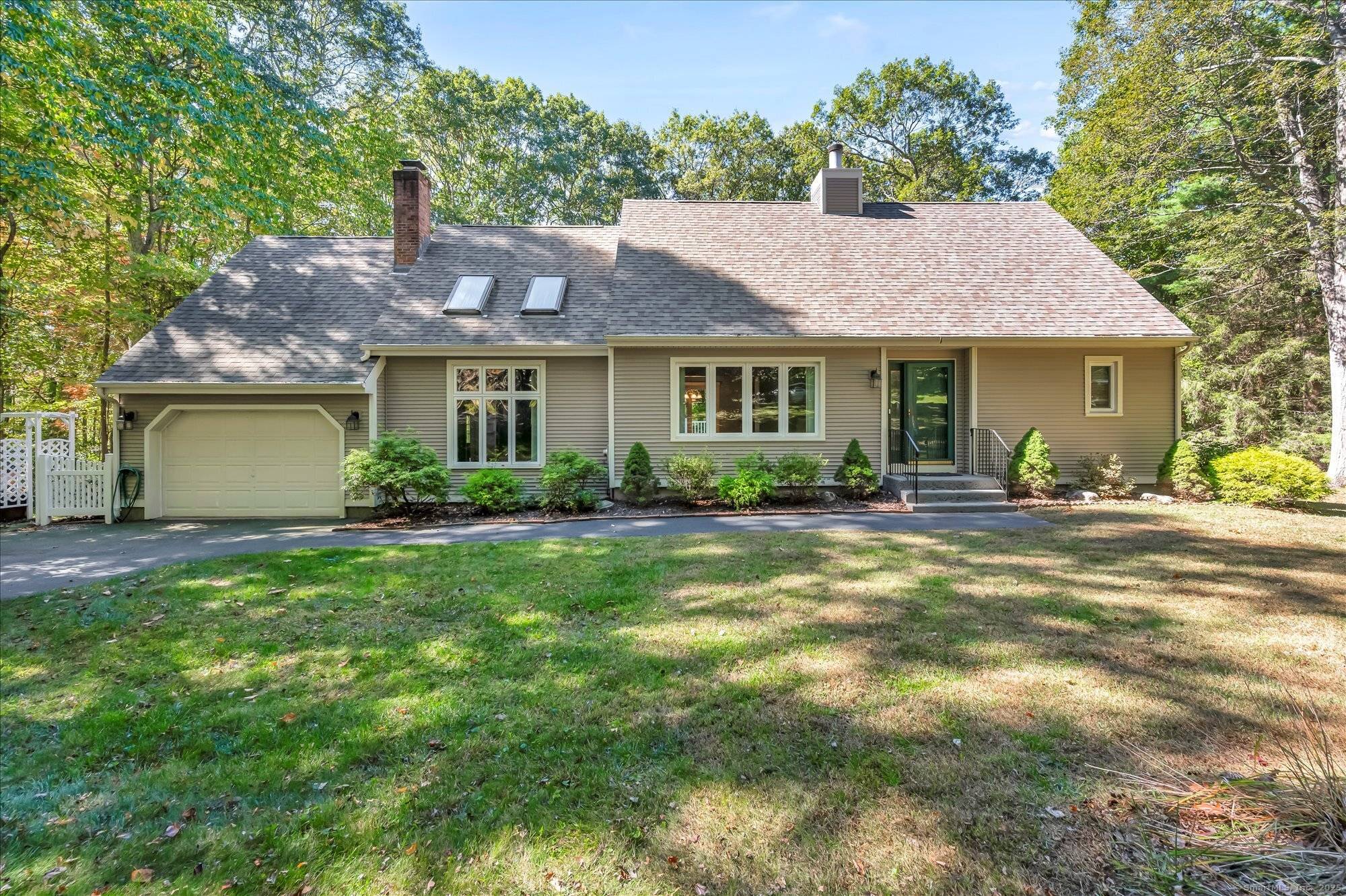 Nestled in the desirable Island Woods community, this home offers the perfect combination of privacy, abundant natural light, and neighborhood charm in a quiet, no through traffic setting.