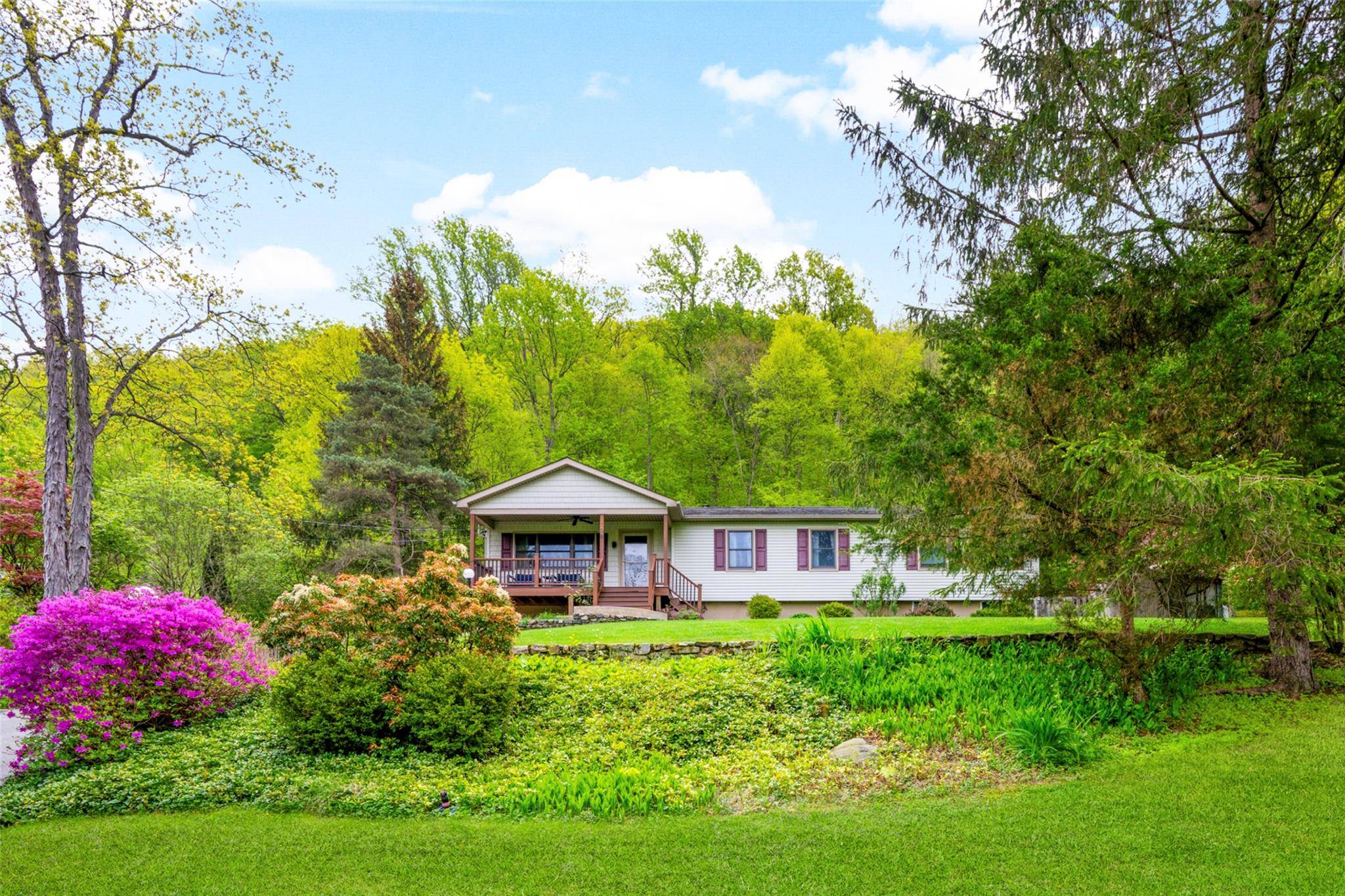 Welcome to your personal Hudson Valley retreat an impeccably maintained home nestled on over 1.