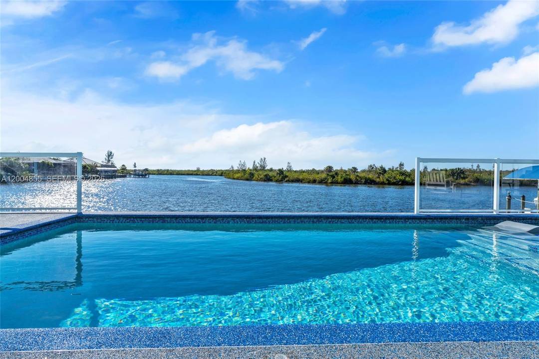 Experience modern coastal luxury in this custom built 2025 waterfront home with direct sailboat access to the Gulf.