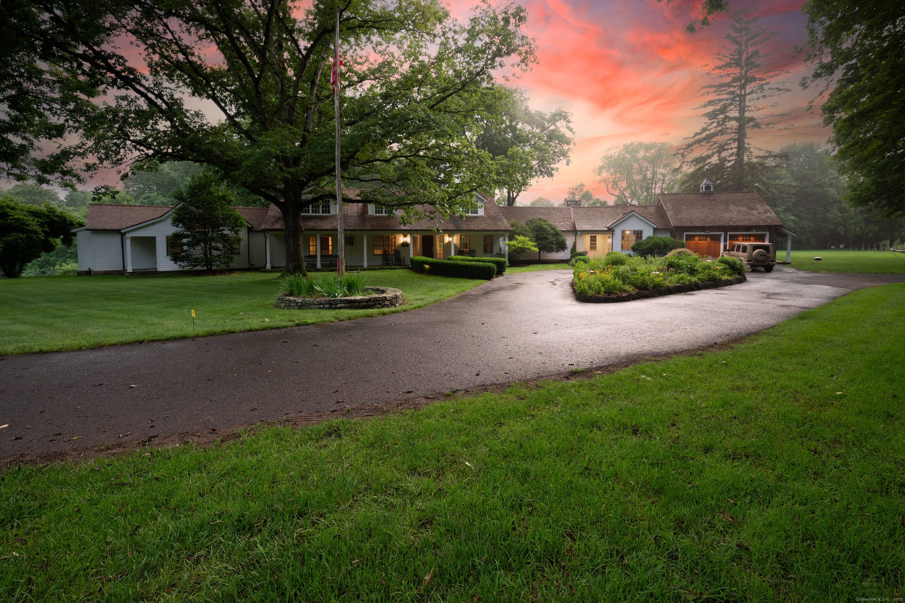 Tucked away in absolute privacy, yet centrally located, this exceptional estate offers 6, 300 square feet of refined living space that seamlessly blends country sophistication modern luxuries.