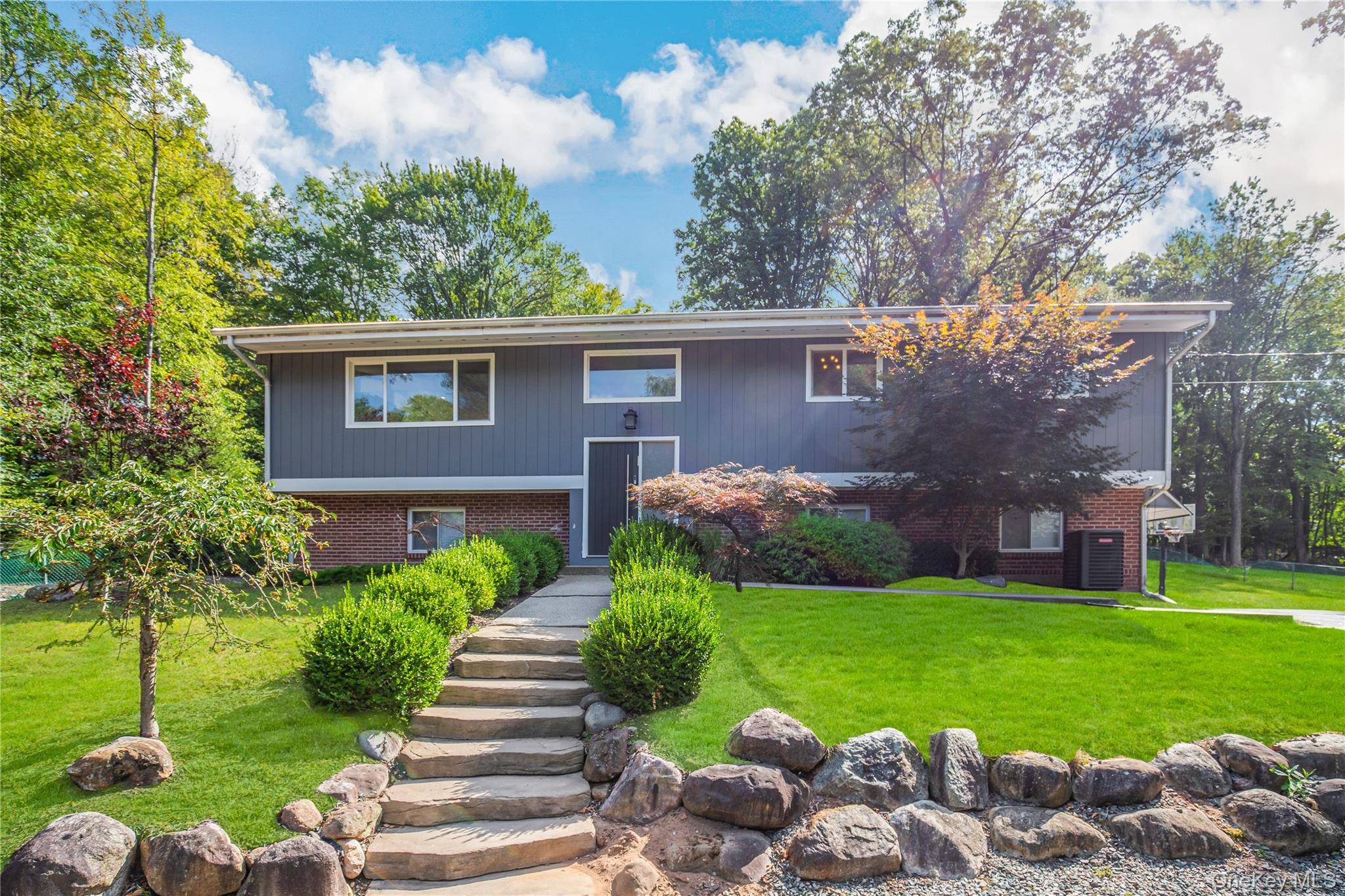 Move right into this completely renovated home in the heart of desirable Wesley Hills.