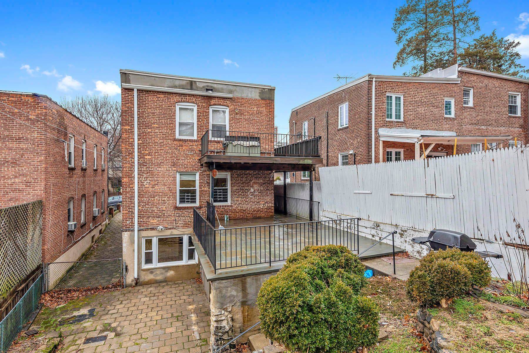 COUNTRY SETTING IN THE CITY a Beautiful Brick Two Family Detached Home on quiet tree lined street in North Riverdale.