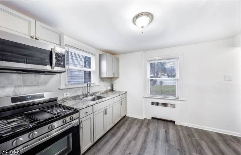 STILL AVAILABLE. Right across the street from Whitney Houston Academy K 12, you'll find this recently renovated single family home.