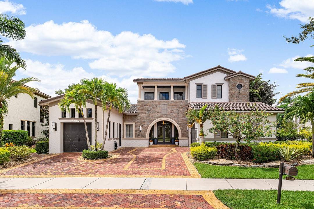 ONE OF A KIND ESTATE IN PARKLAND GOLF CC W STUNNING FAIRWAY LAKE VIEWS.