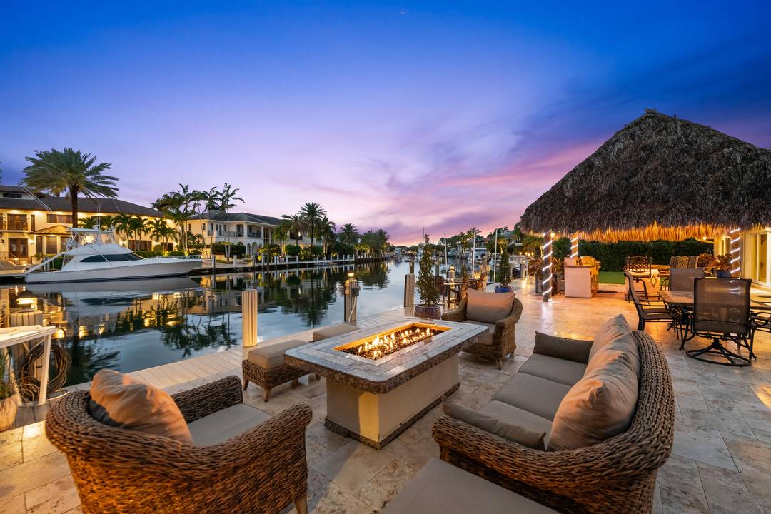 Welcome to your private waterfront retreat on exclusive Lake Placid Island in Lighthouse Point where luxury living meets effortless ocean access.