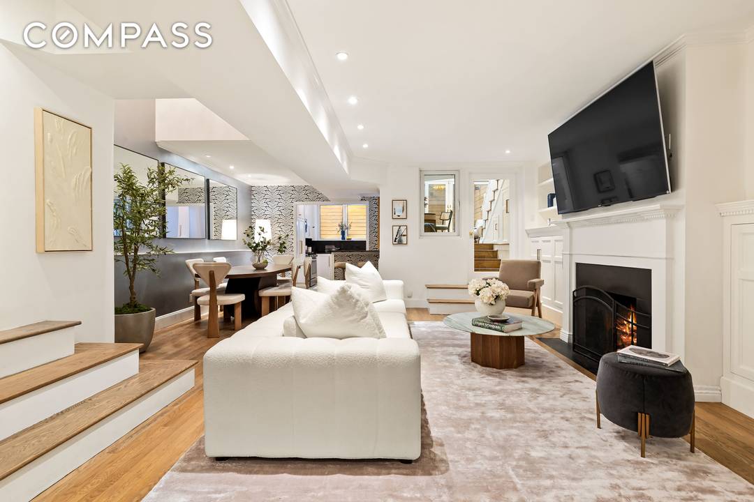 A rare and sophisticated south facing garden duplex nestled within a historic landmarked mansion on one of Manhattan s most coveted blocks just moments from Central Park.