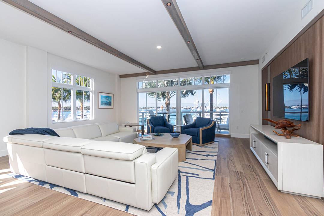 This waterfront residence offers stunning marina and sunset views, creating an ideal retreat for water lovers.