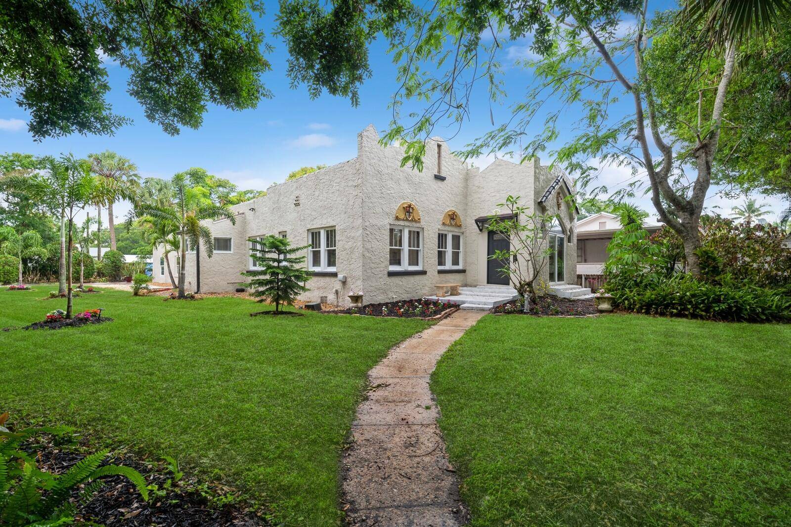 Step into timeless elegance with this freshly painted Spanish style home, originally built nearly 100 years ago and thoughtfully restored for today's lifestyle.