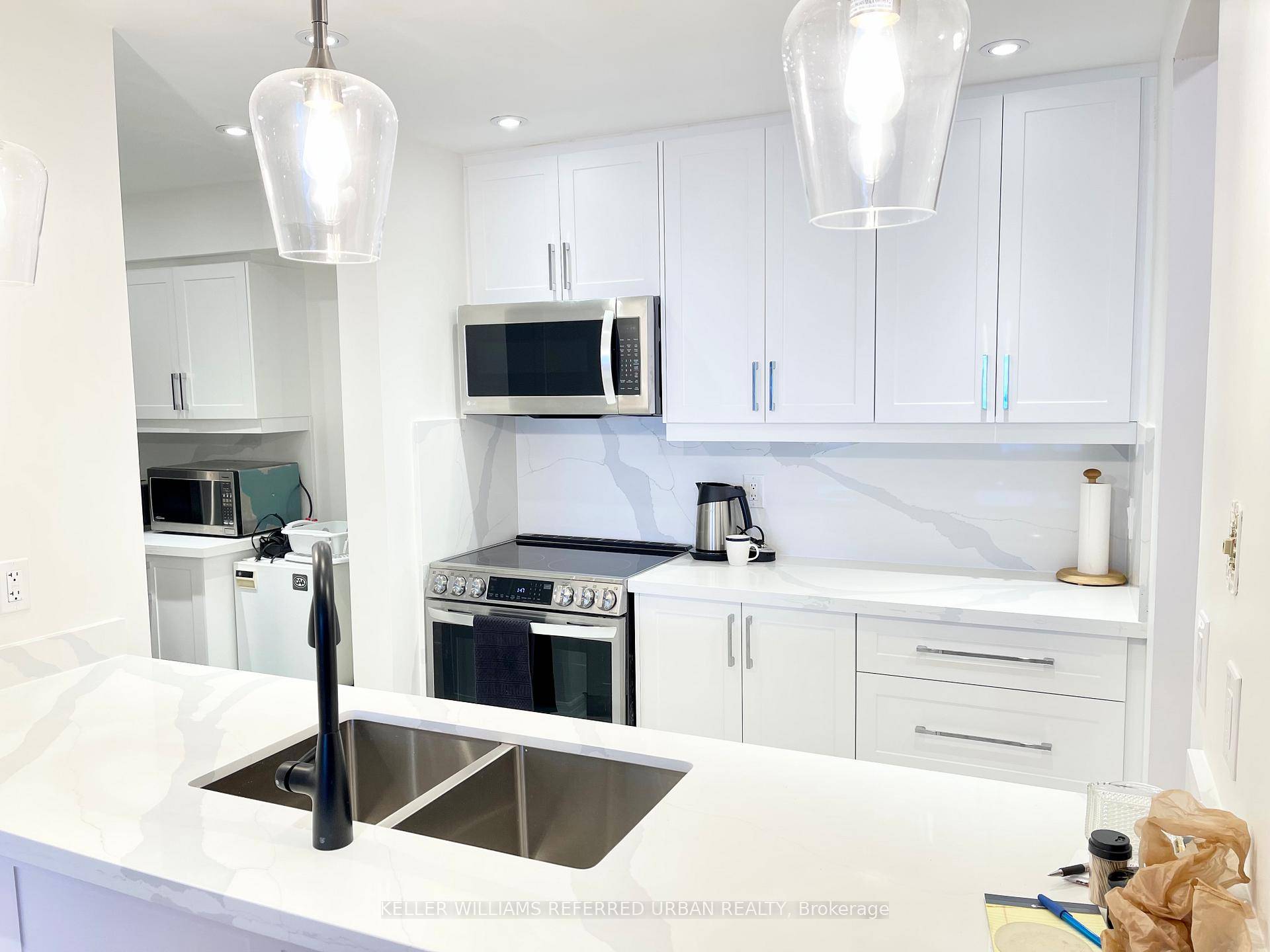 Beautiful Renovated In Over 850 sqft High Ceilings Large 1 Bedroom fits King Size Bed with Walk In Closet Solarium with Floor To Ceiling Windows 1 Underground Parking Spot !