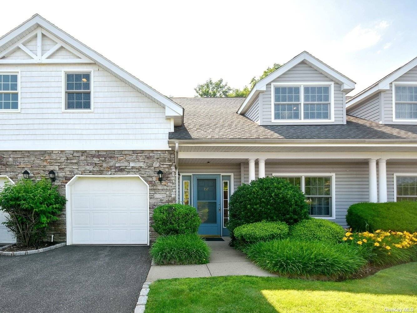 55 Gated Community Nantucket Model Townhouse features scenic pond amp ; fountain views providing a peaceful and tranquil setting.