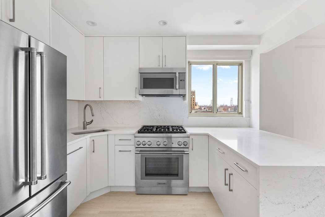 Triple mint private floor two bedroom two bathroom condominium with lovely open views and outdoor space located at the nexus of Greenwich Village, Union Square, and the East Village.