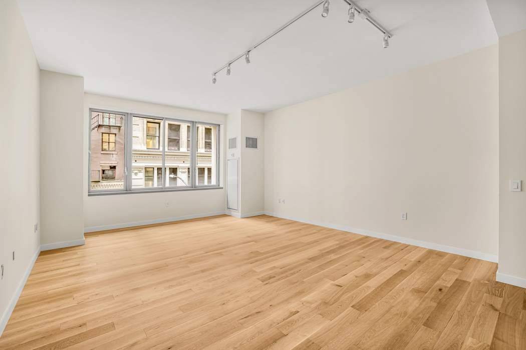 Rarely available two bedroom three bathroom loft located in a luxury, boutique condop.