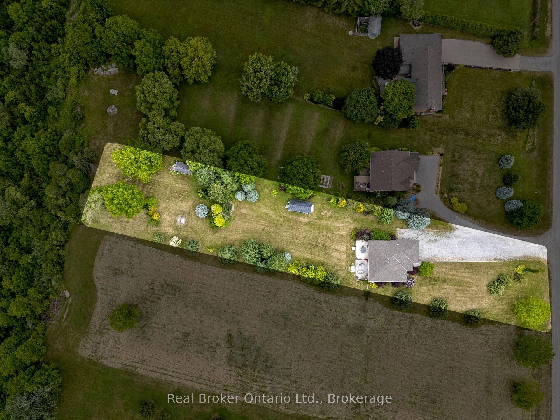 An incredible opportunity awaits in this spacious all brick bungalow set on a scenic 1 acre lot with ravine views on the banks of the Grand River.