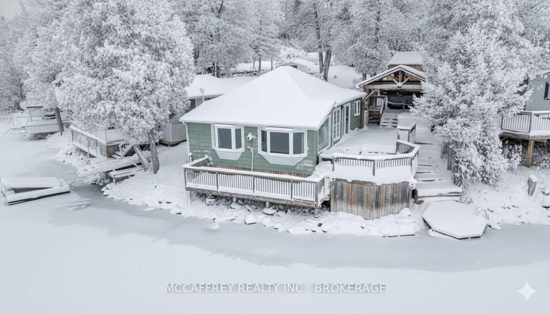 Welcome to 19 Cherry Lane, a beautifully appointed, three bedroom, two bath cottage that fuses rustic charm with refined comforts all set on a coveted waterfront lot on Beaver Lake.