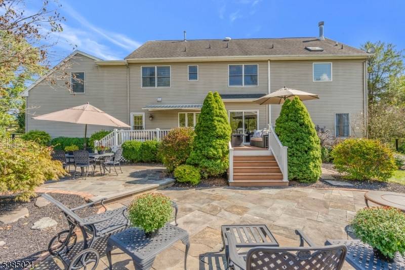 Nestled in a picturesque neighborhood of similarly styled homes, this spacious Colonial sited on 3 private acres offers timeless elegance modern comfort across 14 beautifully appointed rooms.