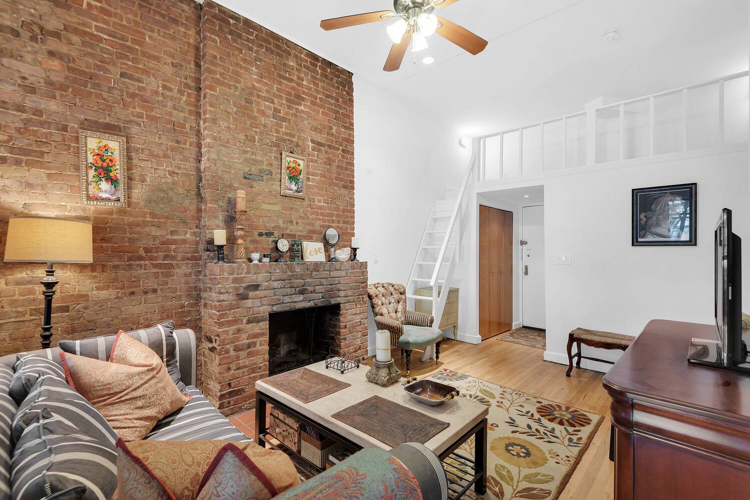 This one of a kind one bedroom residence features dramatic double height ceilings and a versatile sleeping loft, perfect for added living space, storage, or effortlessly hosting guests.