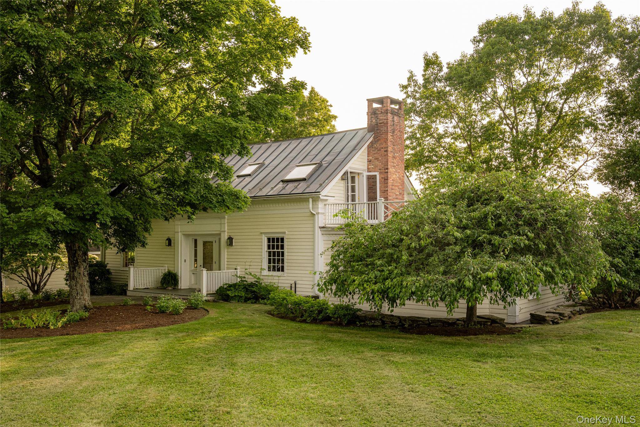 An incredible compound on 47 acres on rolling green hillsides on a beautiful road just minutes to Hudson.