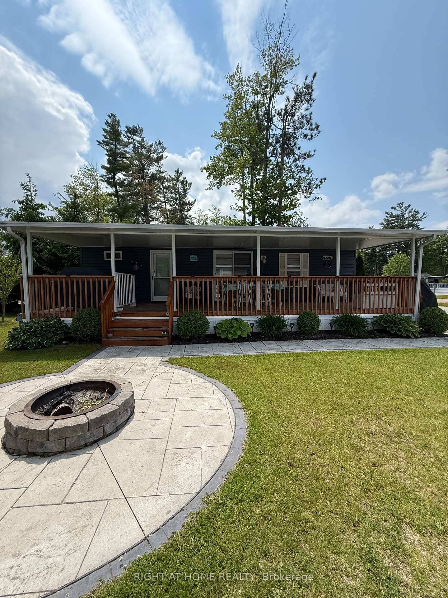 Welcome to 7 Nipagon Cir, a remarkable 2015 Northlander cottage in the desirable Parkbridge's Country Life Gated Resort.