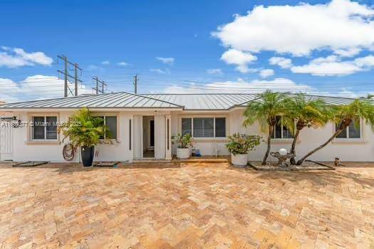 Discover this impressive and fully remodeled property featuring a spectacular driveway, brand new metal roof, and impact resistant windows and doors throughout.