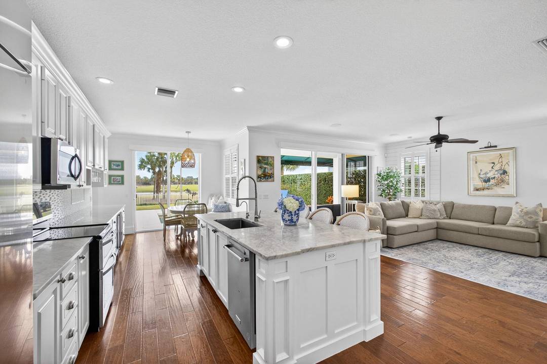 Welcome to this stunning 5 bedroom office single family residence ideally positioned on the 3rd hole of the Abacoa Golf Course, offering breathtaking fairway views and exceptional privacy.