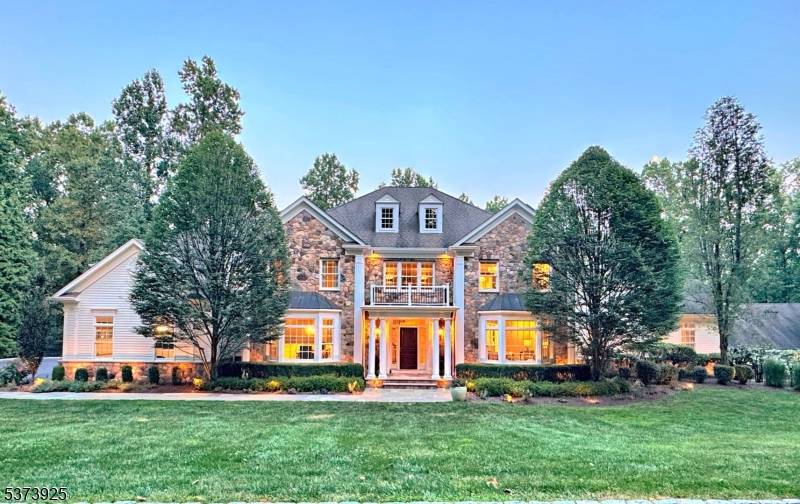 Perched atop the prestigious Bernardsville Mountain on a private cul de sac, this masterfully designed Colonial estate spans 7 acres of manicured grounds, offering an exceptional blend of timeless architecture, ...
