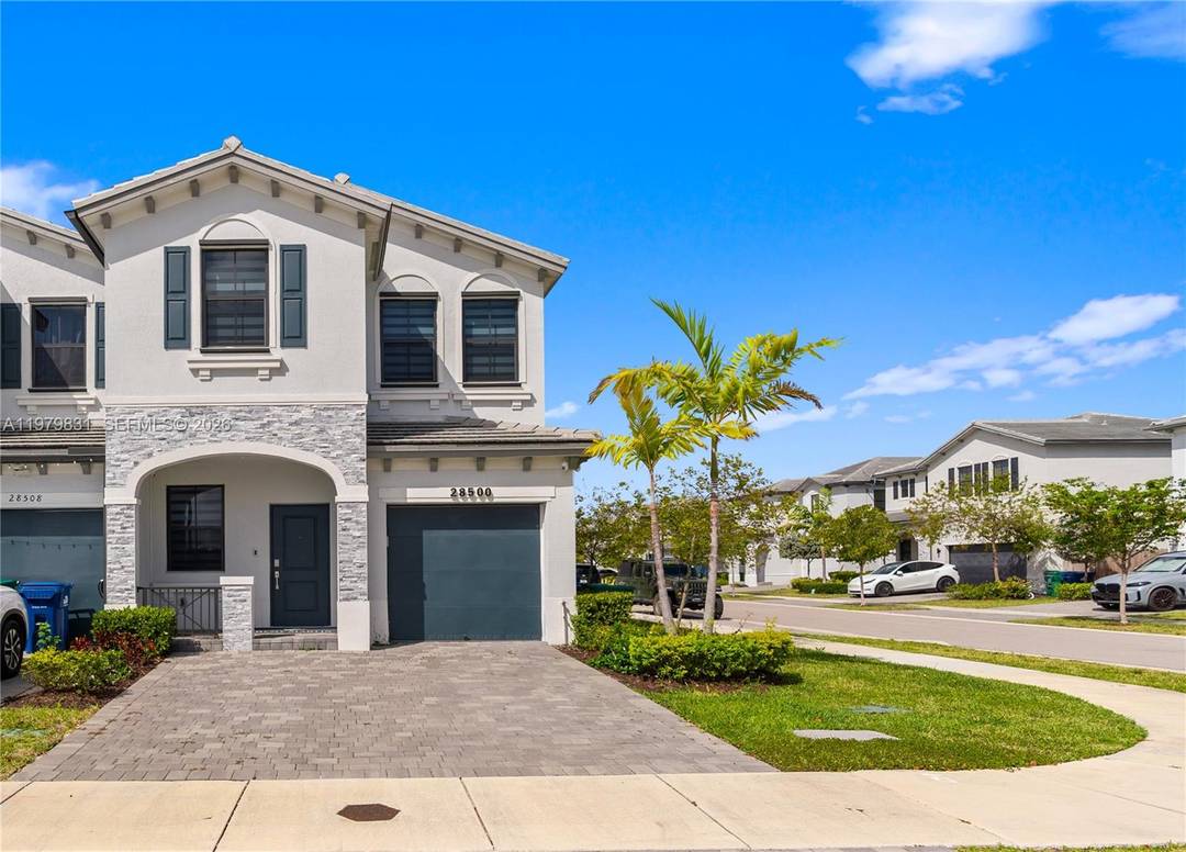 Stunning luxury corner unit townhouse located in a resort style gated community in the rapidly growing city of Homestead.