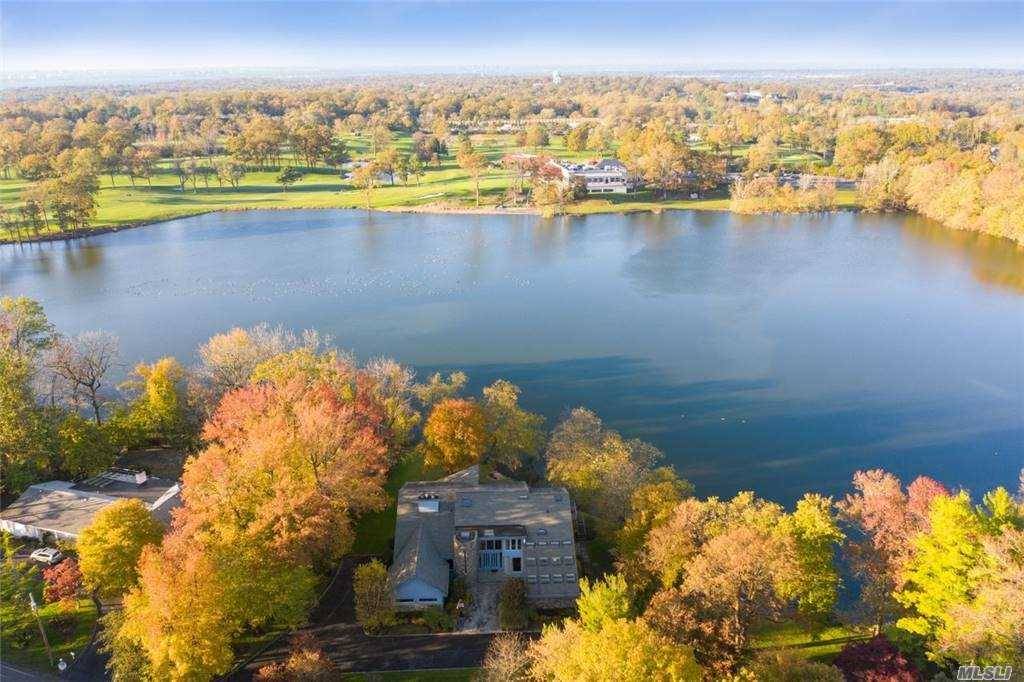 Set on a spectacular waterfront property of almost one acre on Lake Success, this modern architectural masterpiece boasts 7500 SF of luxurious finishes, spacious rooms, and soaring ceilings around an ...