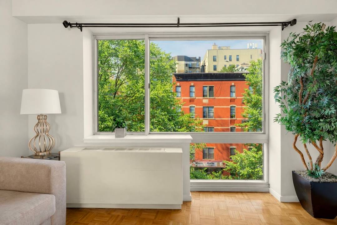 Welcome to Apartment 503, a spacious three bedroom, two bathroom residence spanning 1, 254 square feet with east and west exposures.