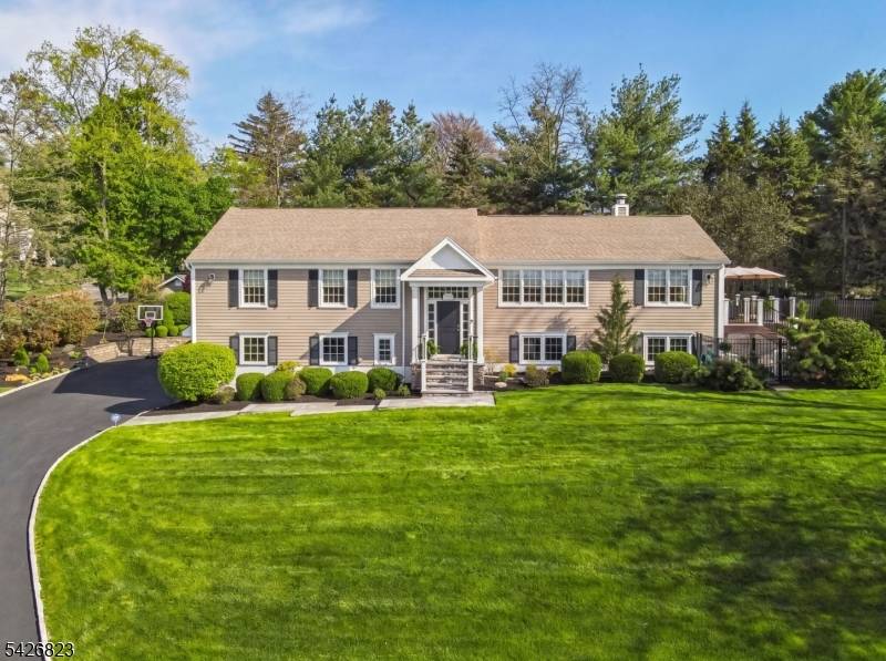 Set on nearly half an acre in the coveted Wickham Woods section of Chatham Township, this custom built home blends timeless elegance with modern updates and exceptional indoor outdoor living.