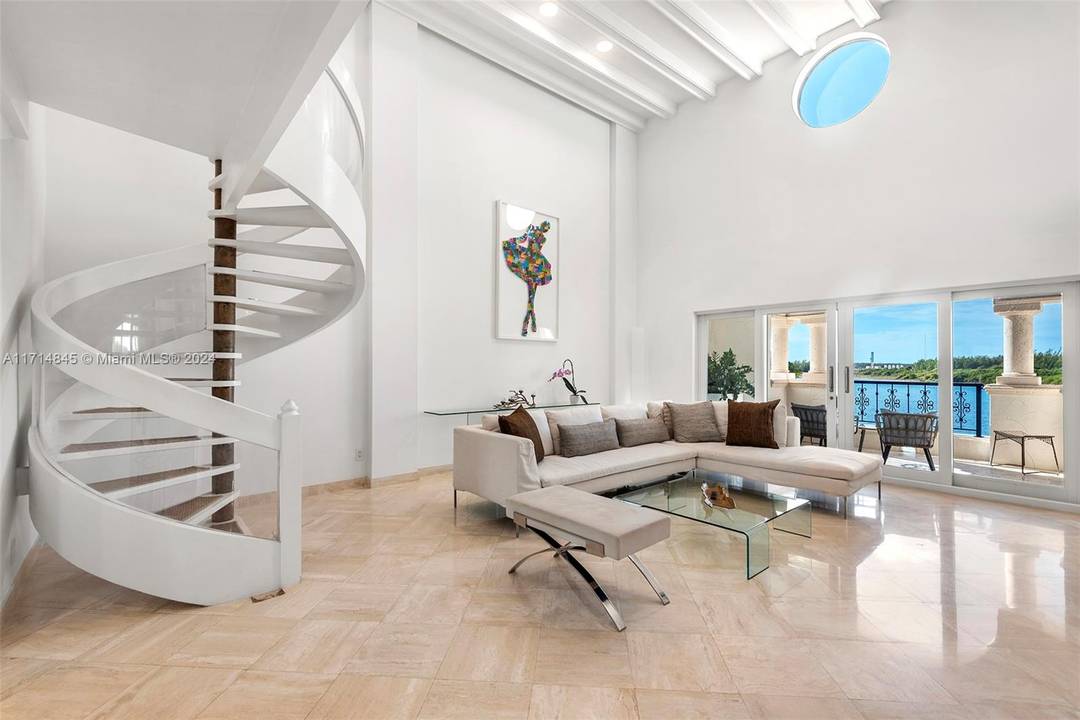 Visit this stunning two story Bayside Village Townhouse on Fisher Island overlooking Biscayne Bay and the Miami Downtown Skyline !