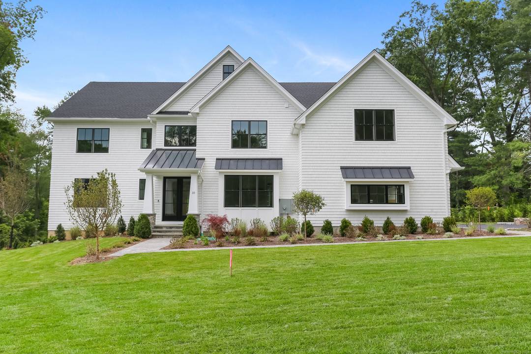 This is the second of 2 custom homes, beautifully sited at the end of a private lane in the heart of Greens Farms.