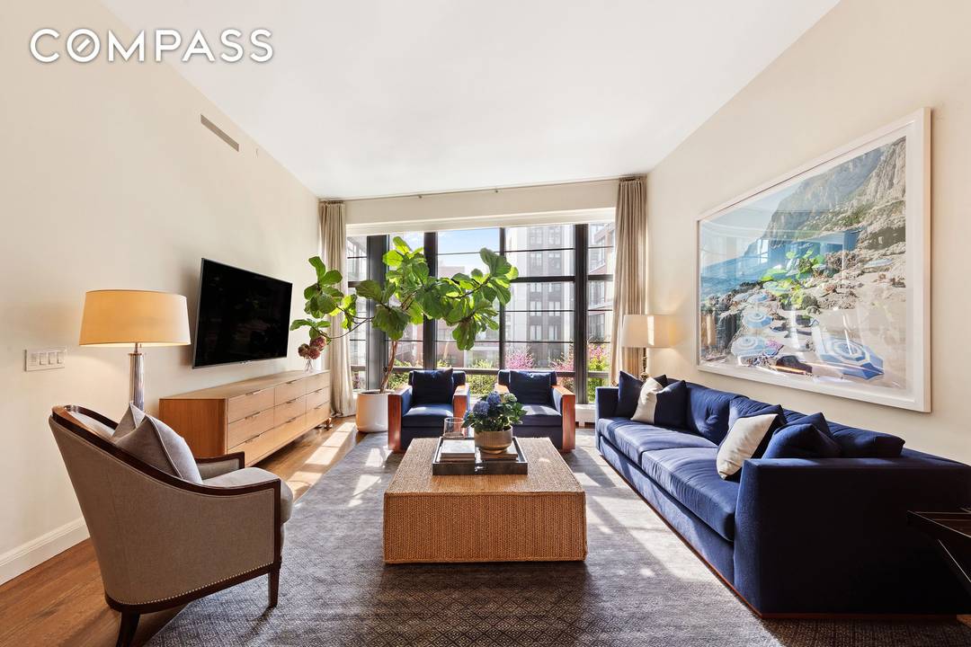A private elevator opens into a grand foyer, leading to an oversized great room with floor to ceiling windows.