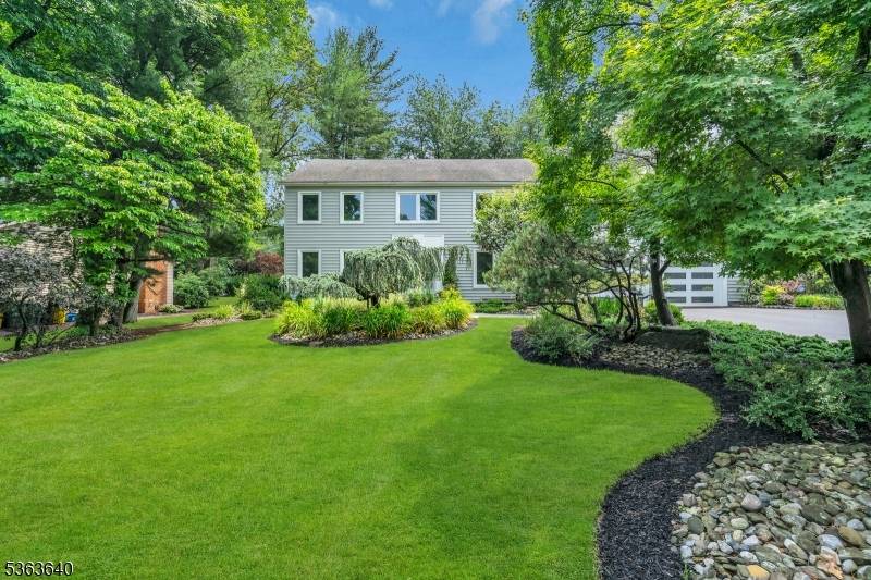 Welcome to this exceptional custom built Center Hall Colonial by renowned builders Ray Way, located in one of the area's most desirable private neighborhoods.