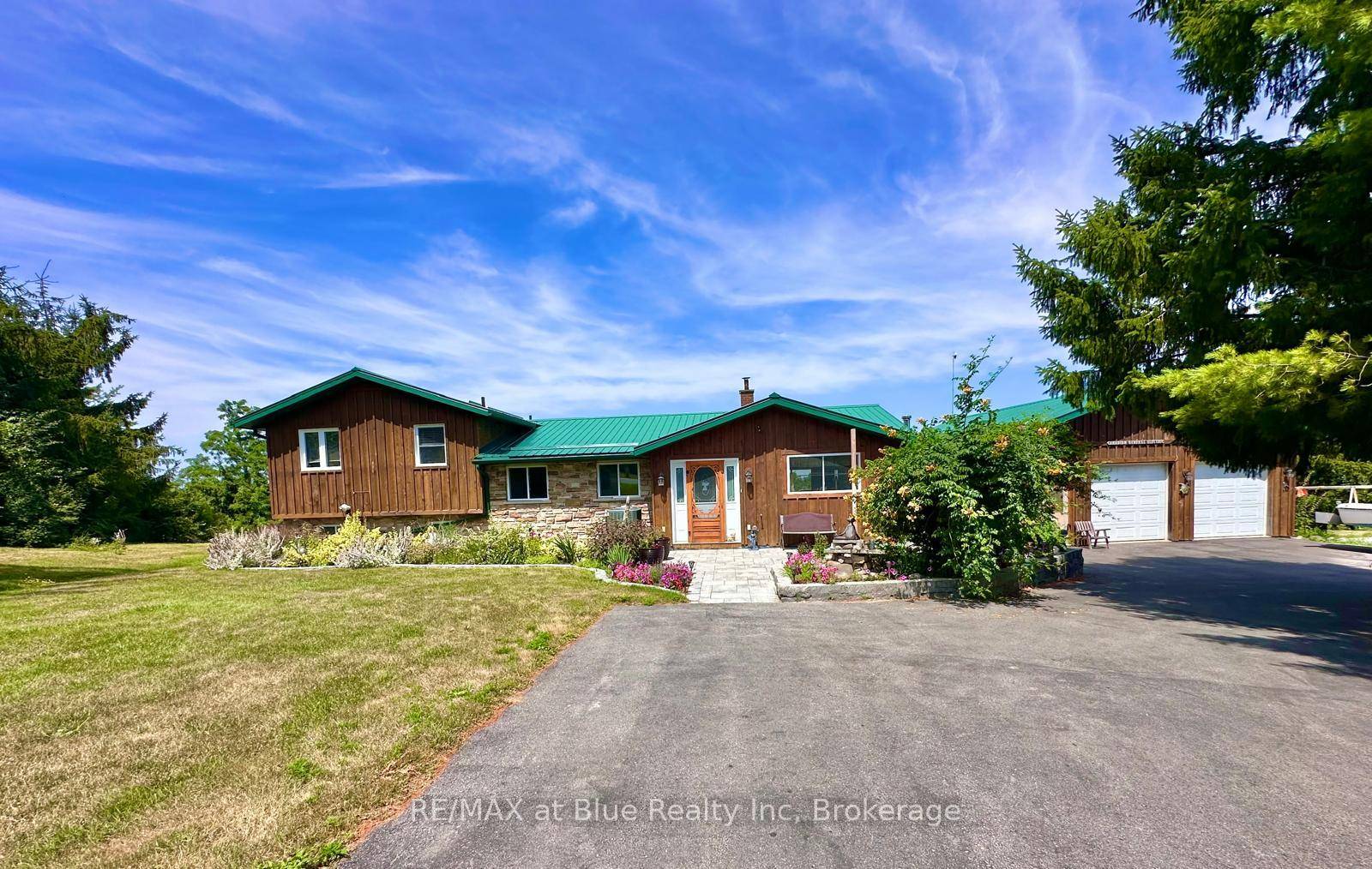 Panoramic Lake Views, Deeded Waterfront, and Oversized Garage A Rare Find on Rice Lake.