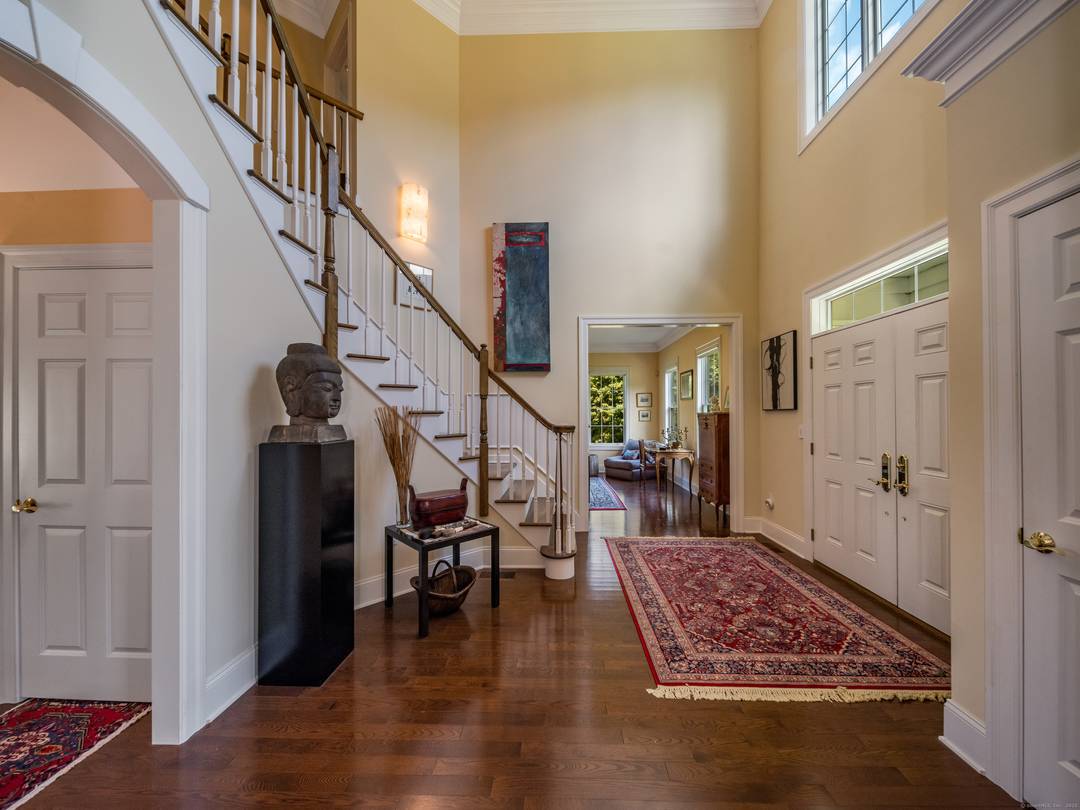 This Colonial style home, custom built in 2004, features beautiful, oversized windows so the home enjoys abundant natural light in every room in the house.