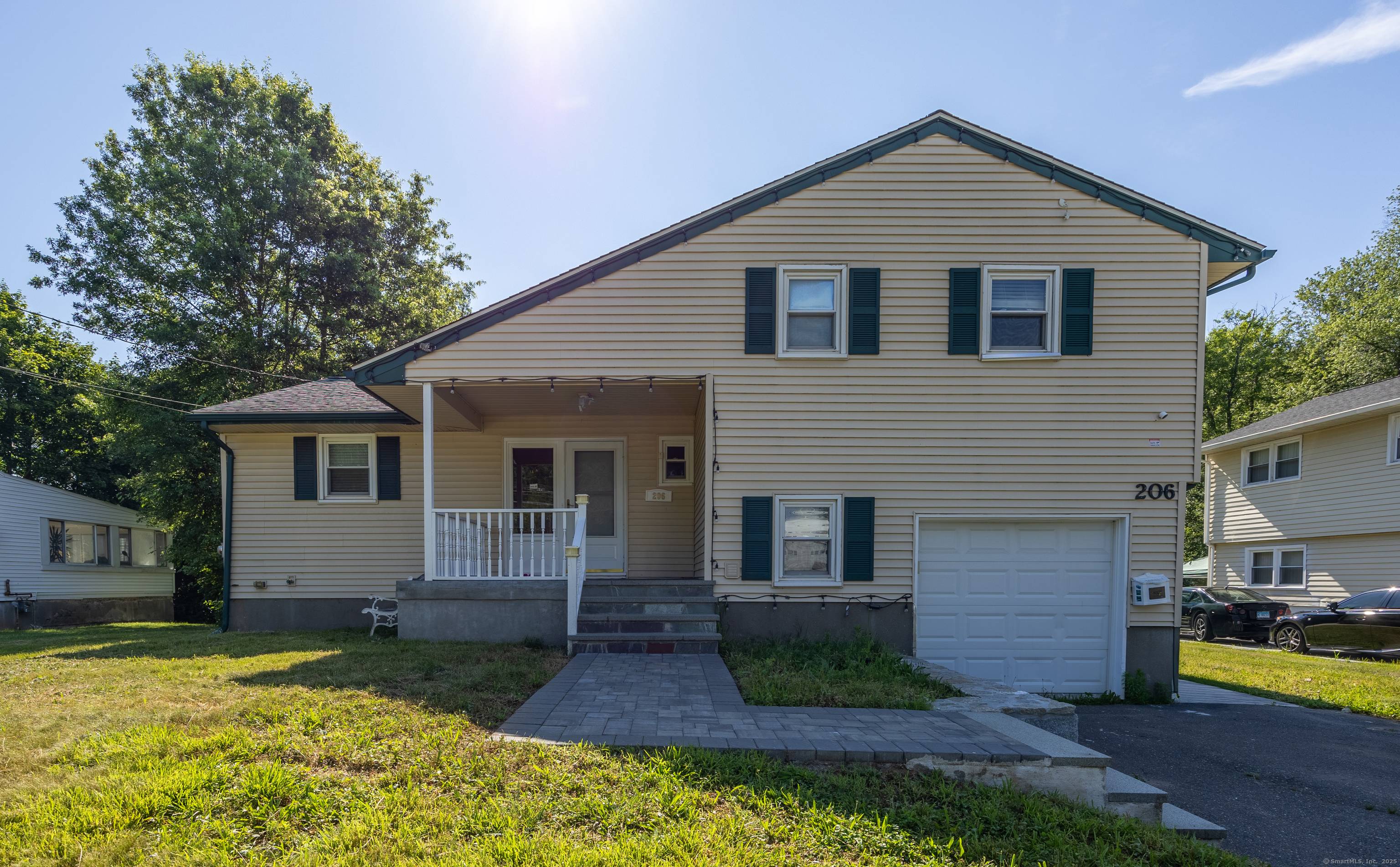 Welcome to 206 Mohegan Drive, a beautifully updated split level home backing directly to the Hartford Golf Club.