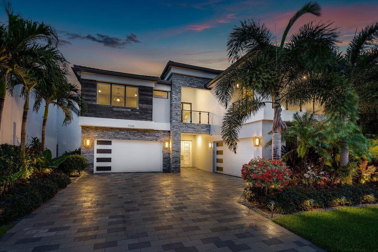 You are going to fall in love with this stunning lakefront 6 bedroom, 8 bathroom, 4 car garage estate in the highly sought after community of Lotus.
