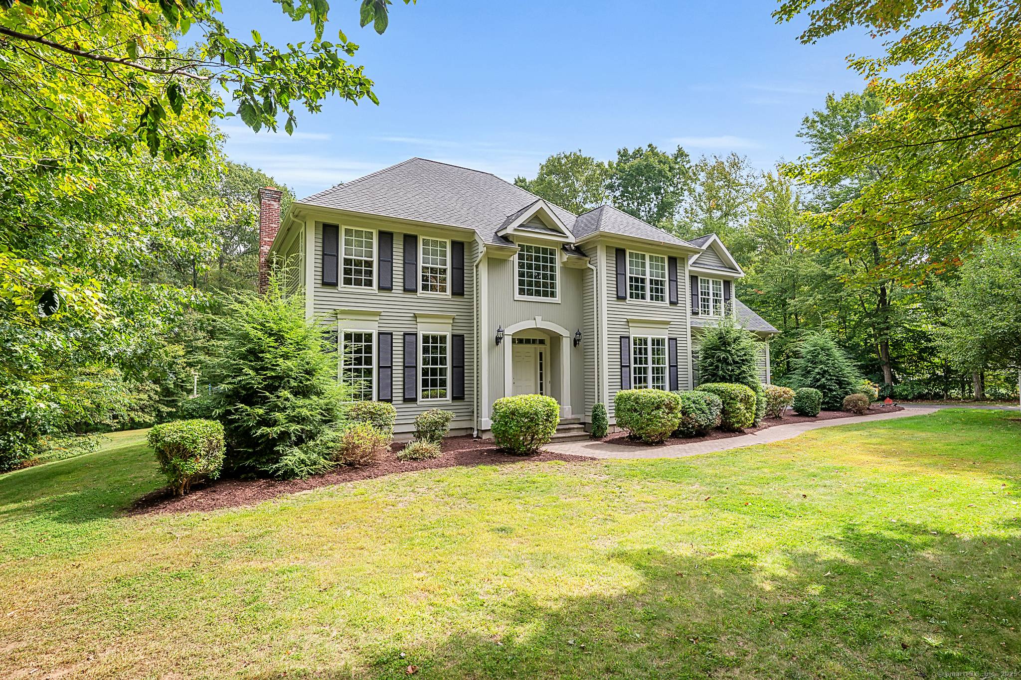 Special announcement this custom built grand colonial is nestled on a completely level one acre lot with the utmost of privacy from the street and neighboring homes.