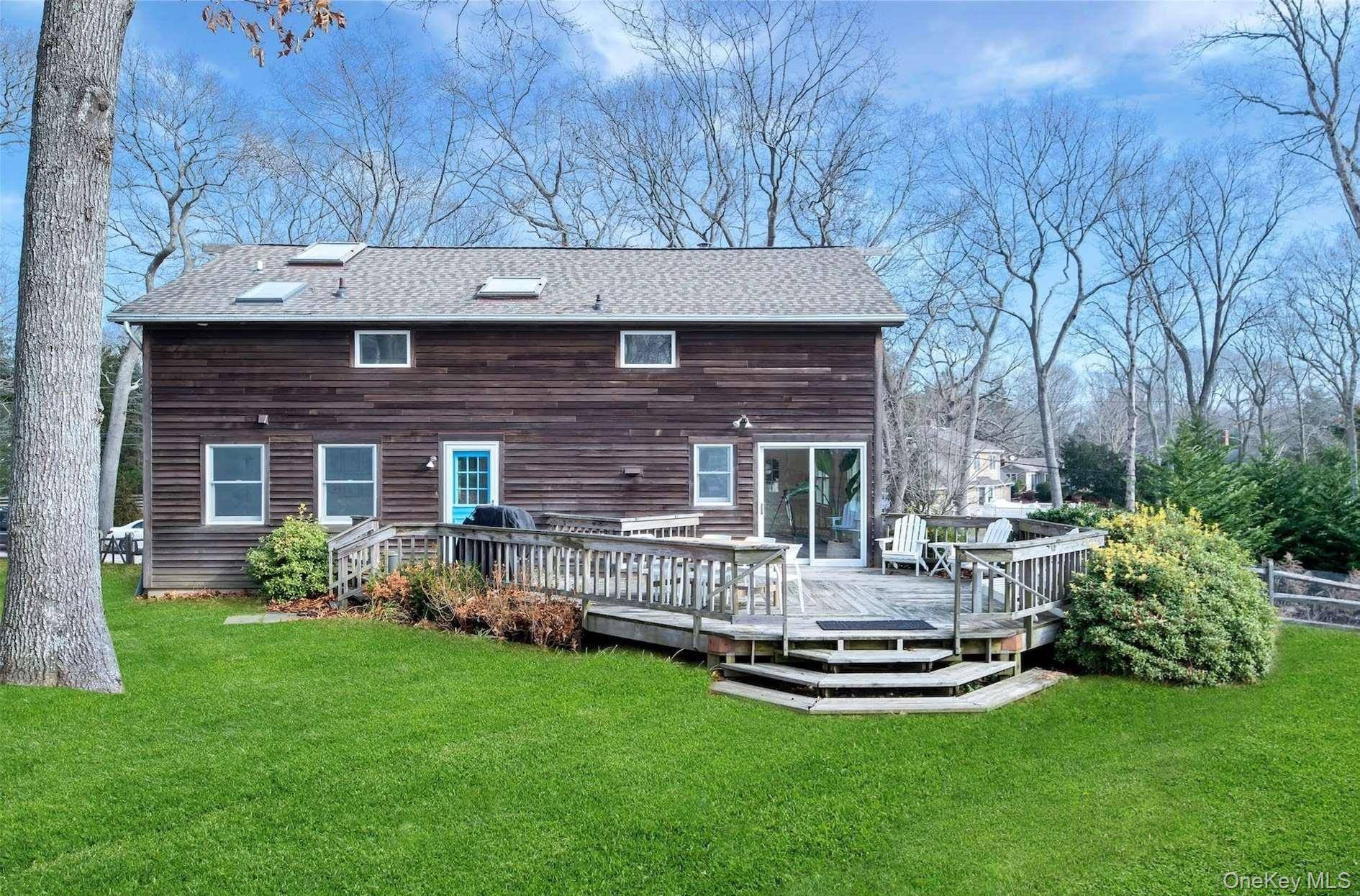 Embrace refined living in this charming residence nestled in the heart of Southold.