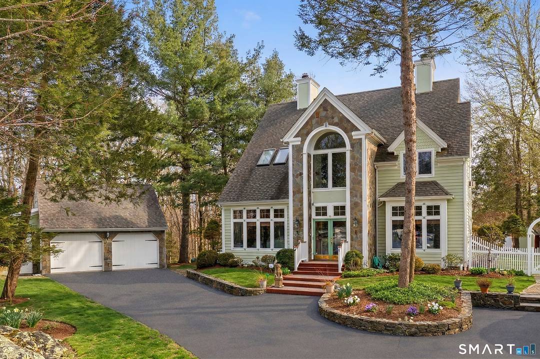 Perched high on 2 private acres, this home is an ideal full time primary residence or a peaceful weekend retreat.