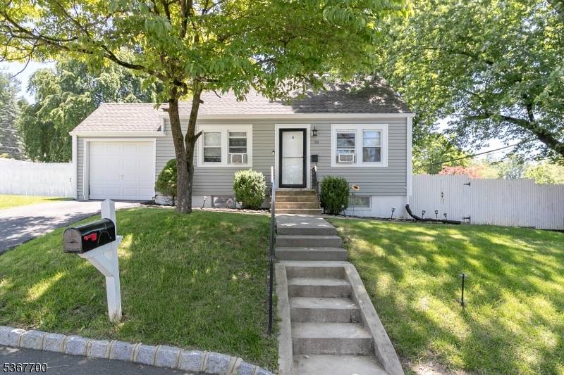 Adorable cape cod style home has the perfect blend of space and style waiting for you !