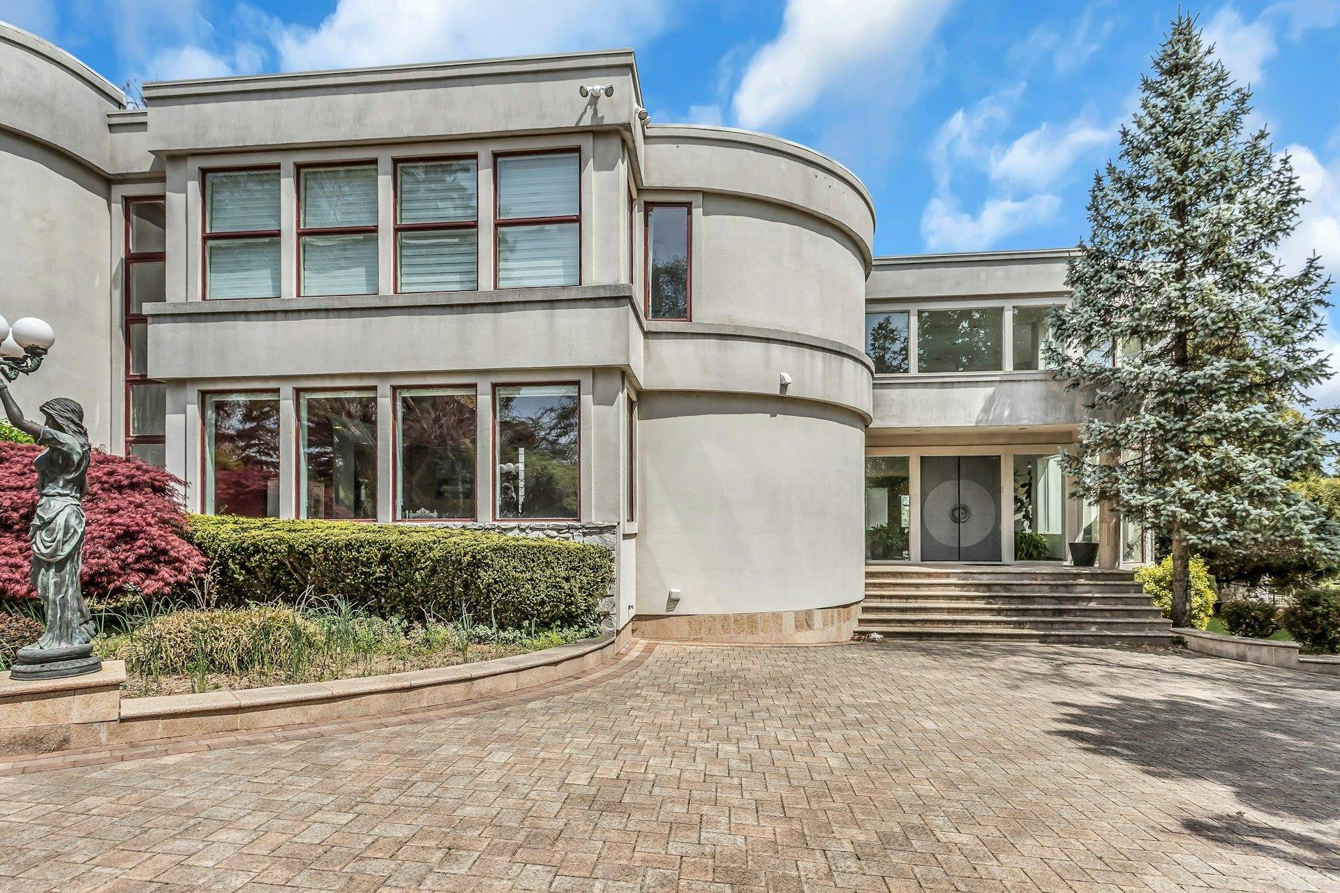 Situated on a private road in Kings Point, this grand residence offers an exceptional blend of scale, elegance, and elevated design, with breathtaking water views.