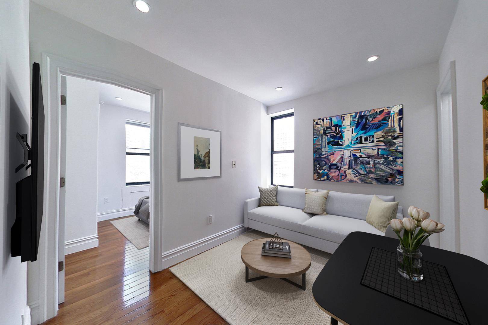 This newly renovated, cozy corner apartment is flooded with sunlight and features recessed lighting and new wide plank hardwood flooring throughout.